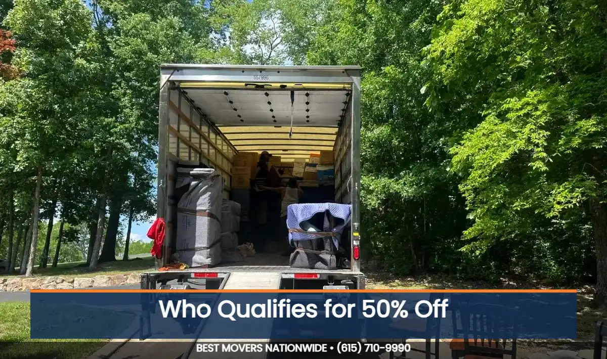 JM Moving 26-foot box truck with ramp down, loaded for a move