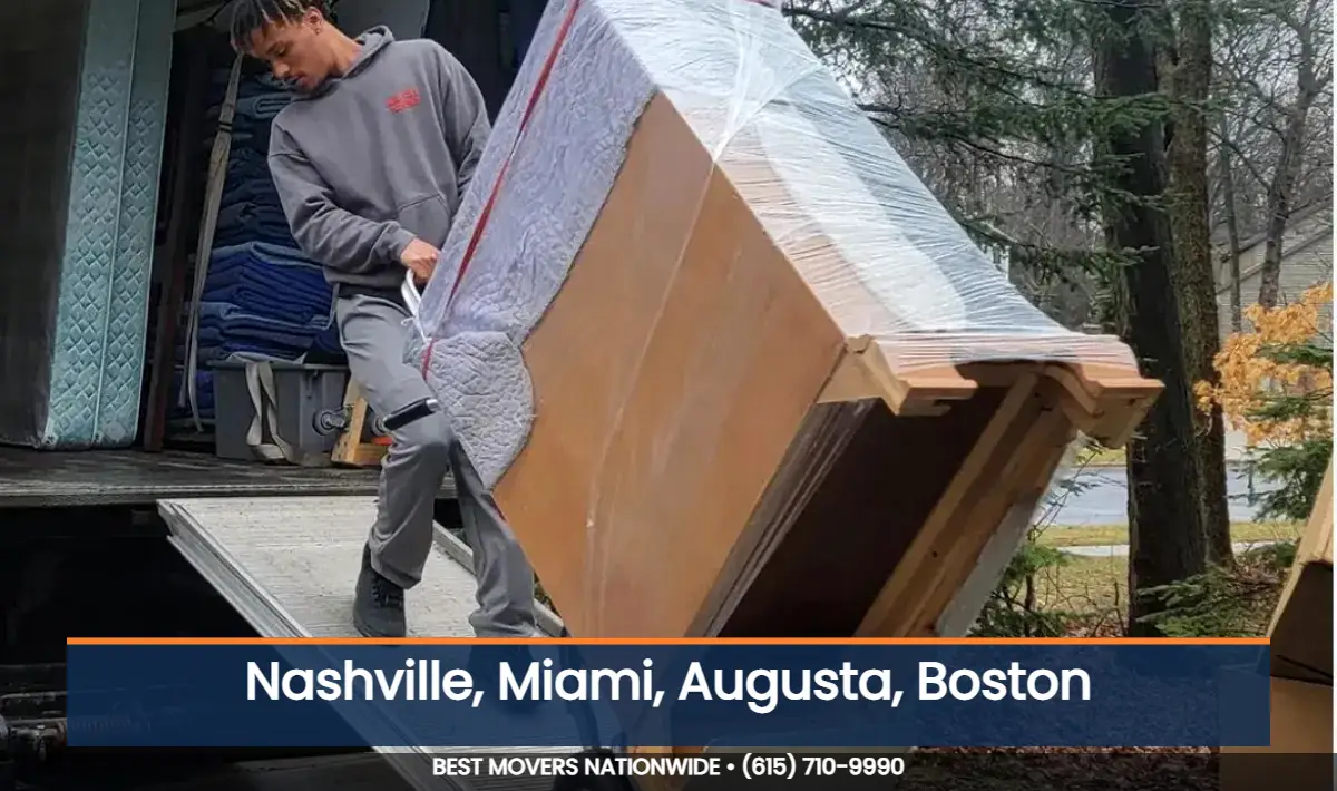 JM Moving mover rolling wrapped furniture on a dolly